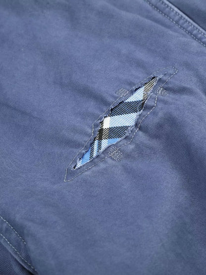 Men's distressed cargo capris in blue, trendy casual pants with a relaxed fit and multiple pockets, by Trendsi.