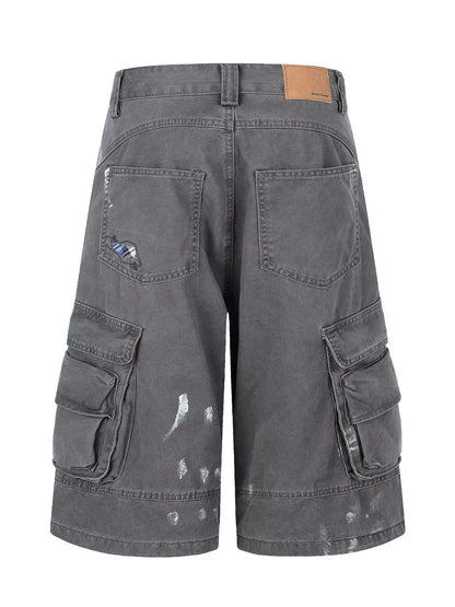 Men's distressed cargo capris in blue by Trendsi, featuring a relaxed fit with multiple pockets and a worn-in, casual style.
