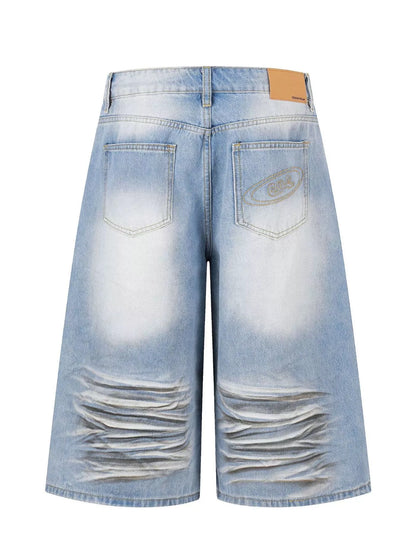 Men's full-size distressed wide-leg Capri jeans by Trendsi, in blue denim with a relaxed fit and stylish distressed details.