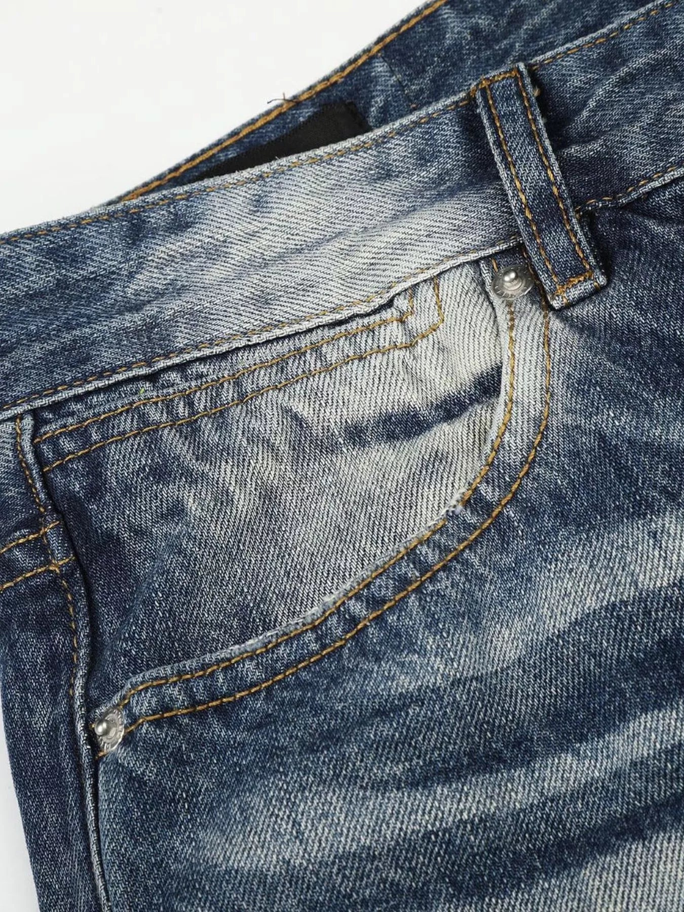 Men's blue washed bootcut jeans with metal studded accents, stylish and relaxed fit from Trendsi.