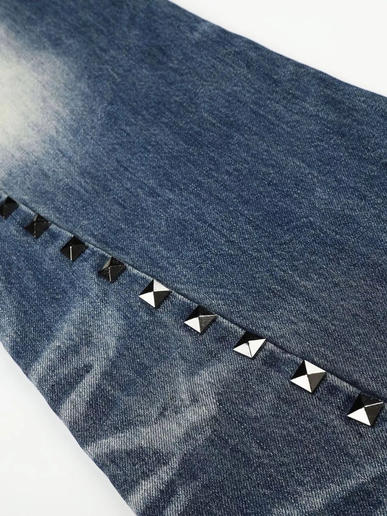 Men's blue studded washed bootcut jeans by Trendsi, featuring distressed details and classic fit, displayed on a hanger.