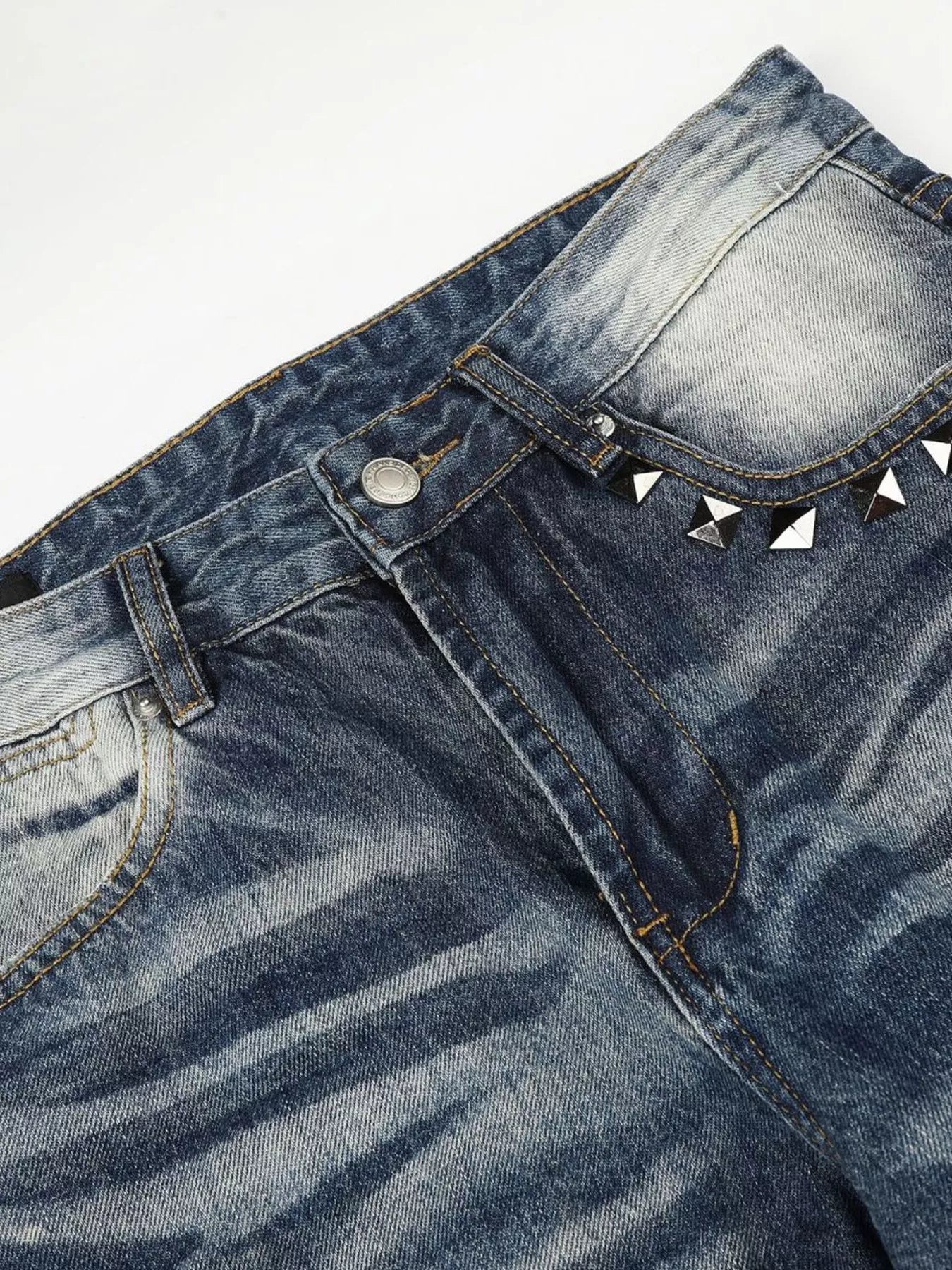 Men's blue washed bootcut jeans with metal studded details from Trendsi, showcasing a relaxed fit and stylish denim design.