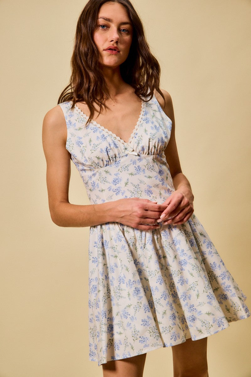 Blue SO ME Froal Print Fit and Flare Dress by Trendsi, featuring a vibrant floral pattern and a flattering fit-and-flare silhouette.