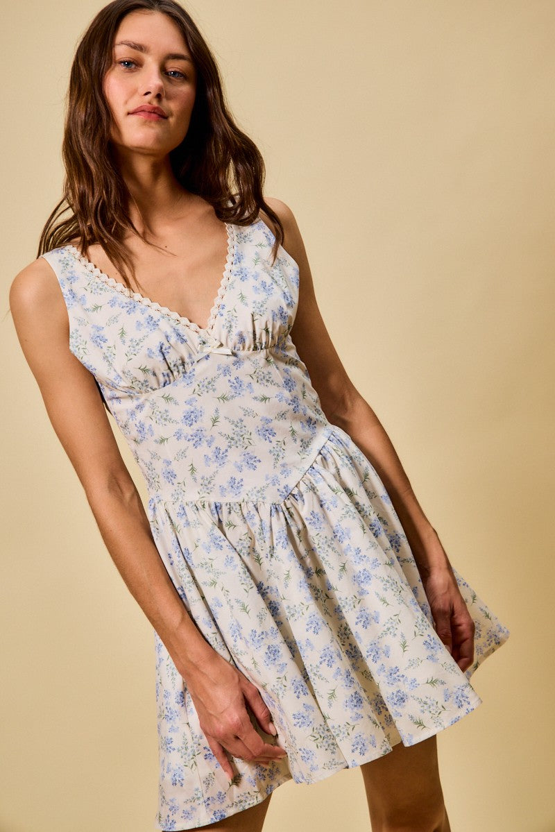 Blue SO ME Froal print fit and flare dress from Trendsi, featuring a stylish floral pattern and flattering silhouette.