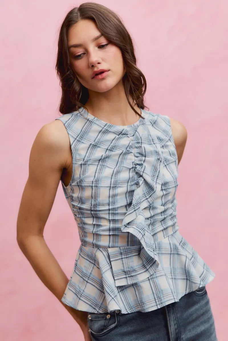 Blue plaid SO ME sleeveless ruffle peplum top with ruffled neckline and fitted waist, styled by Trendsi.