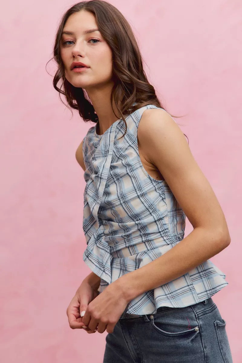 Blue SO ME plaid sleeveless ruffle peplum top by Trendsi, featuring a stylish ruffled design and sleeveless cut.