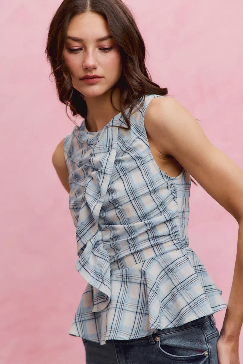 Blue plaid SO ME sleeveless ruffle peplum top by Trendsi, featuring a fitted bodice with ruffle details and a stylish peplum hem.