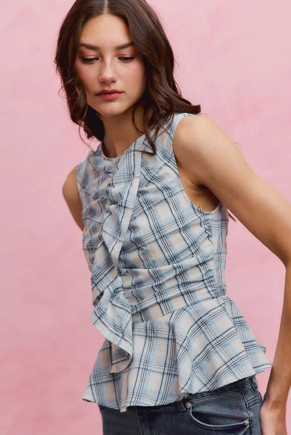 Blue plaid SO ME sleeveless ruffle peplum top by Trendsi, featuring a fitted bodice with ruffle details and a stylish peplum hem.