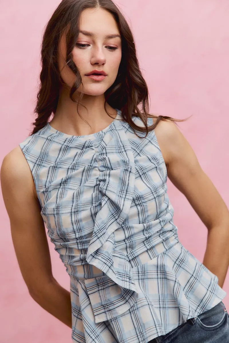 Blue SO ME plaid sleeveless ruffle peplum top from Trendsi, featuring a fitted silhouette with ruffle details at the shoulders.