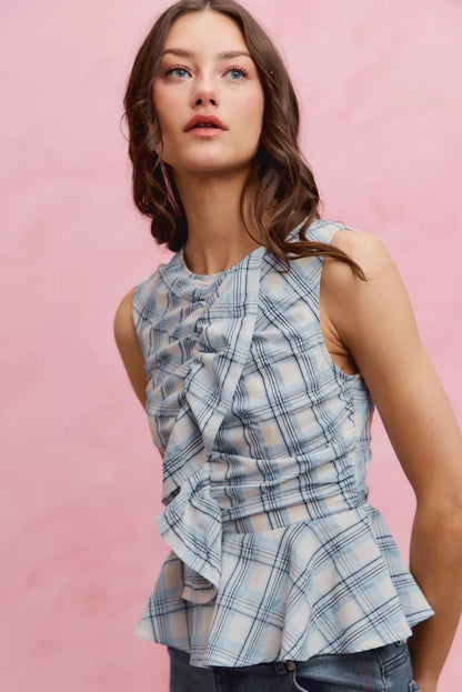 Blue SO ME plaid sleeveless ruffle peplum top by Trendsi, featuring a stylish ruffle detail and fitted peplum design.