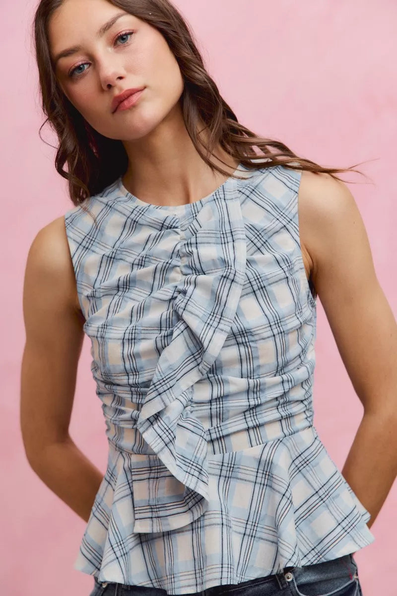 Blue plaid SO ME sleeveless ruffle peplum top by Trendsi, featuring a fitted bodice and feminine ruffle details.