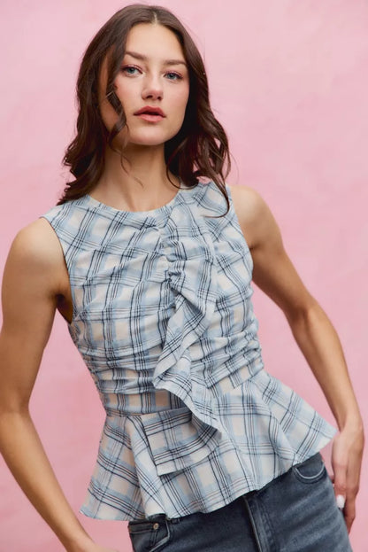 Blue SO ME plaid sleeveless ruffle peplum top by Trendsi, featuring a fitted silhouette and stylish ruffle details.