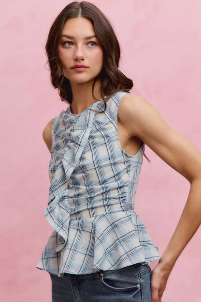 Blue plaid SO ME sleeveless ruffle peplum top by Trendsi, featuring a stylish ruffle detail and fitted peplum waist.