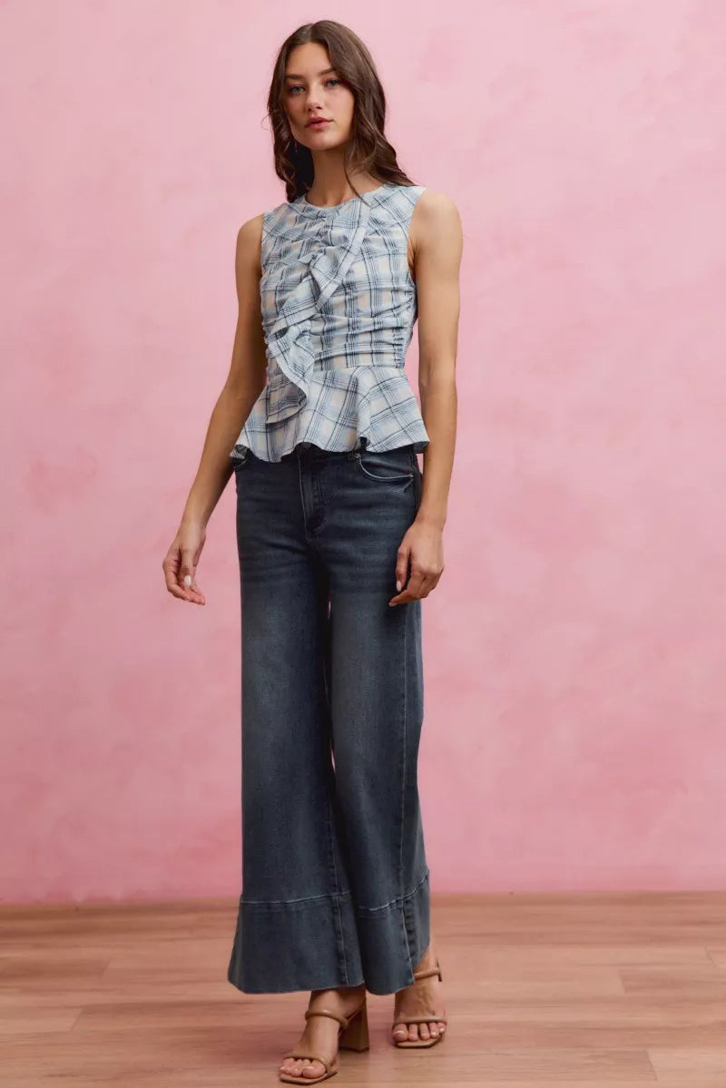 Blue plaid sleeveless ruffle peplum top from SO ME by Trendsi, featuring a stylish peplum hem and ruffled details.