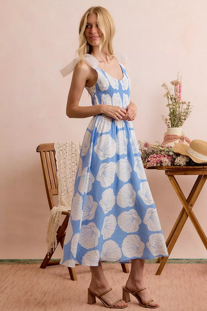 Blue SO ME Shell smocked bodice midi dress with shoulder ties, lined, from Trendsi, shown on a model.