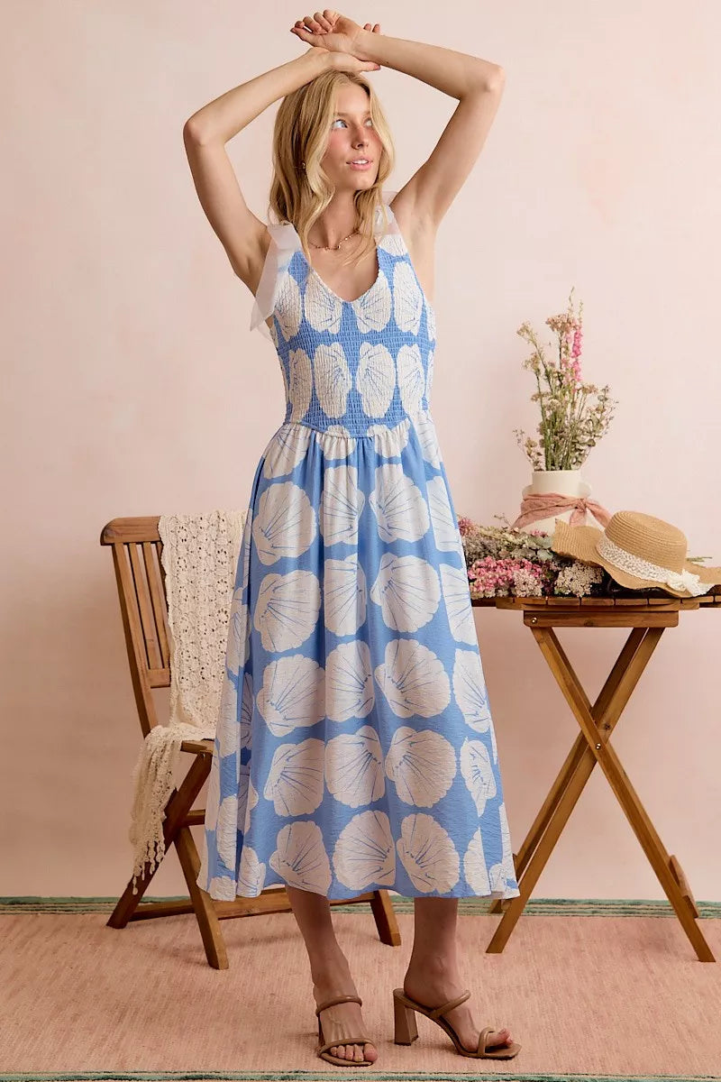 Blue SO ME Shell smocked bodice midi dress with shoulder ties, lined, from Trendsi, shown on a model.
