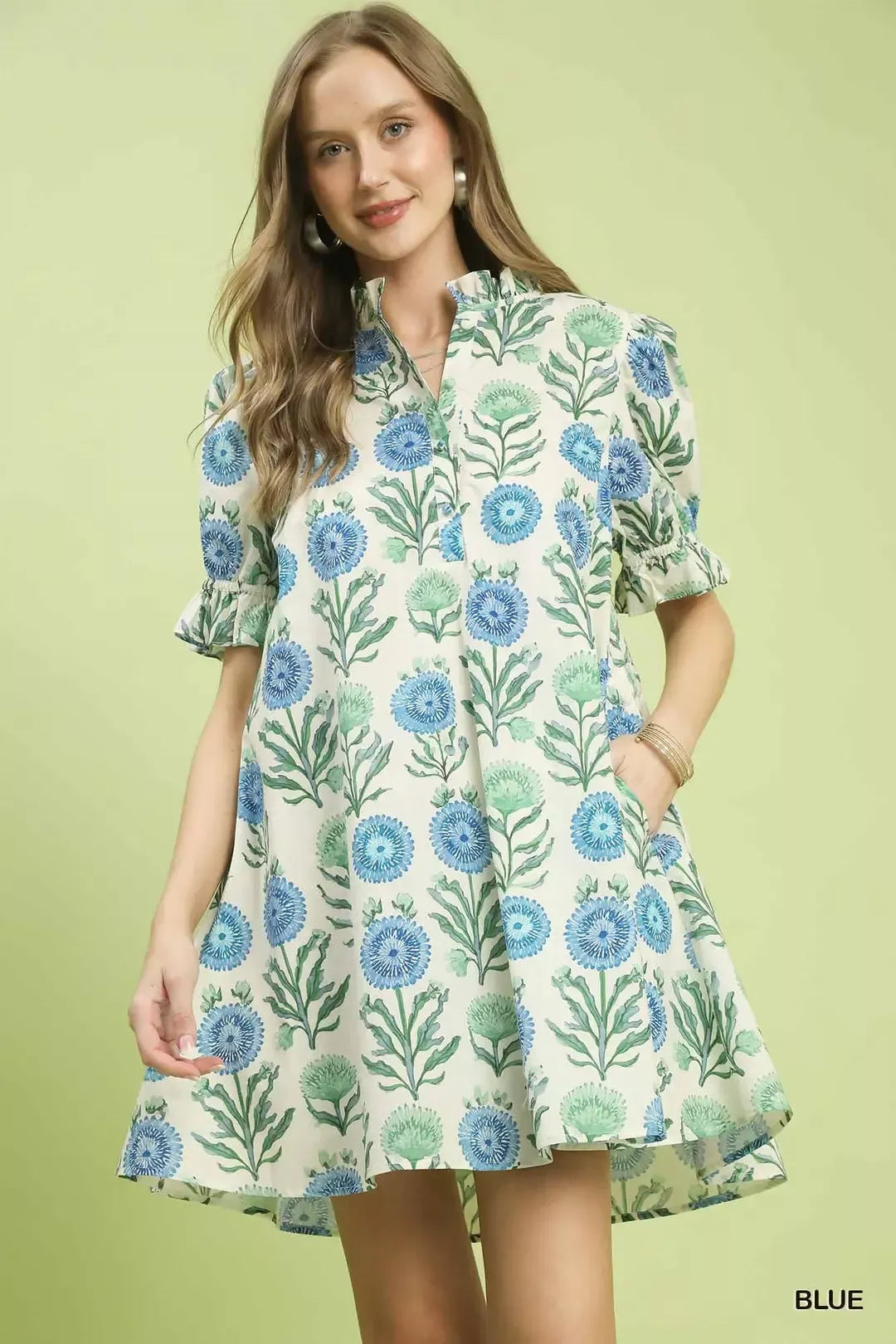 Blue Umgee floral puff sleeve babydoll dress with side pockets, featuring a relaxed fit and feminine design.