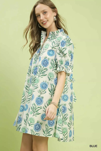 Blue Umgee floral puff sleeve babydoll dress with side pockets, perfect for casual and summer wear.