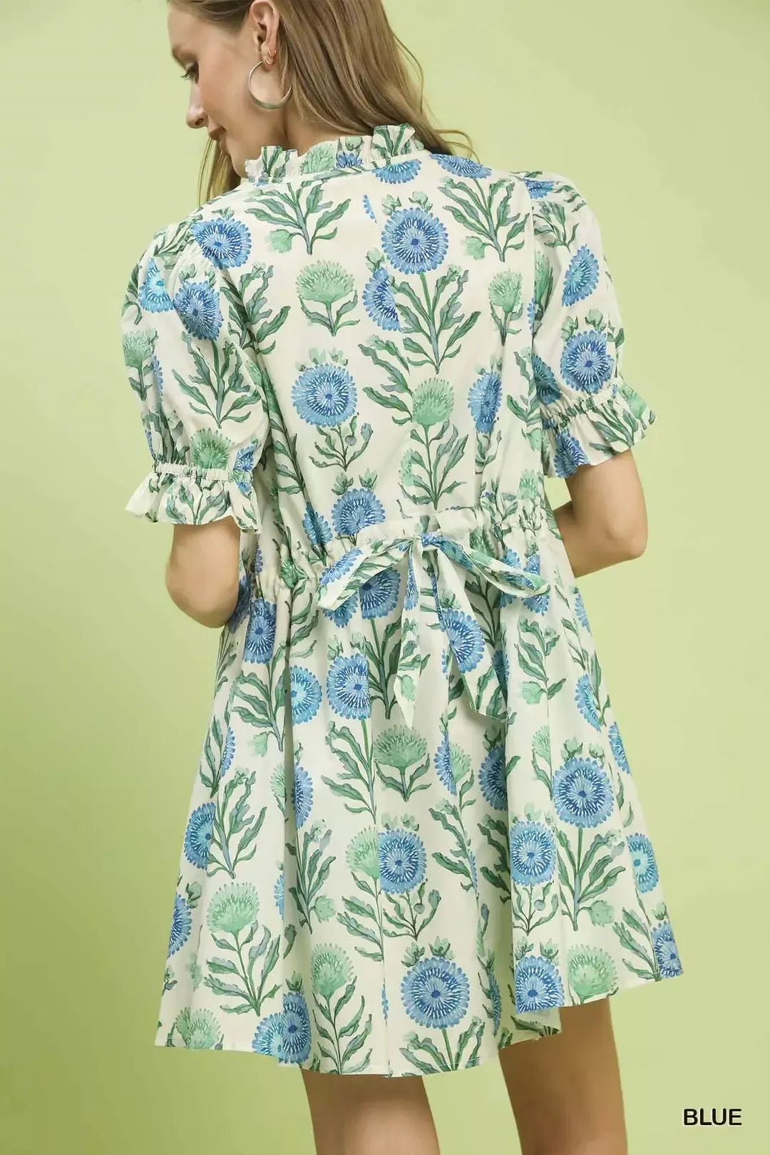 Blue Umgee floral puff sleeve babydoll dress with side pockets, featuring a relaxed fit and feminine design.