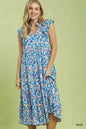 Blue Umgee leaf print midi tiered dress with side pockets, featuring a relaxed, boho-inspired design and flowing fabric.