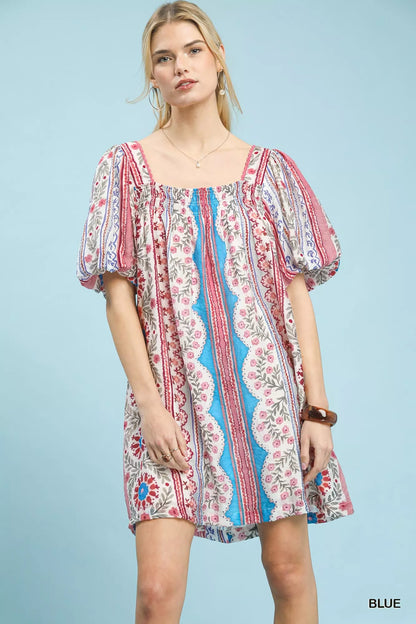 Blue Umgee mixed print puff sleeve mini dress with a fitted bodice and flared skirt, perfect for casual or semi-formal occasions.