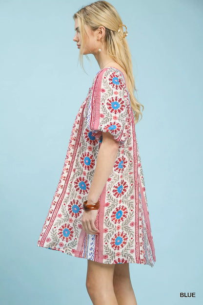 Blue Umgee mixed print puff sleeve mini dress with a fitted silhouette and stylish design, perfect for casual or semi-formal wear.