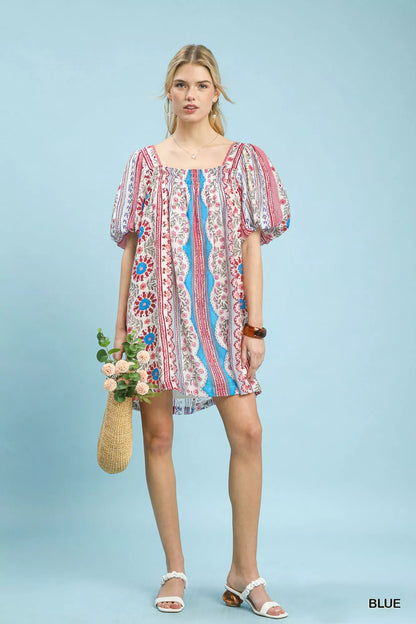 Blue Umgee mixed print puff sleeve mini dress with a fitted silhouette and stylish design, perfect for casual or semi-formal wear.