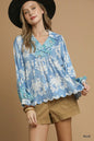 Blue printed long sleeve blouse by Umgee featuring a relaxed fit and stylish design, perfect for casual or dressy occasions.