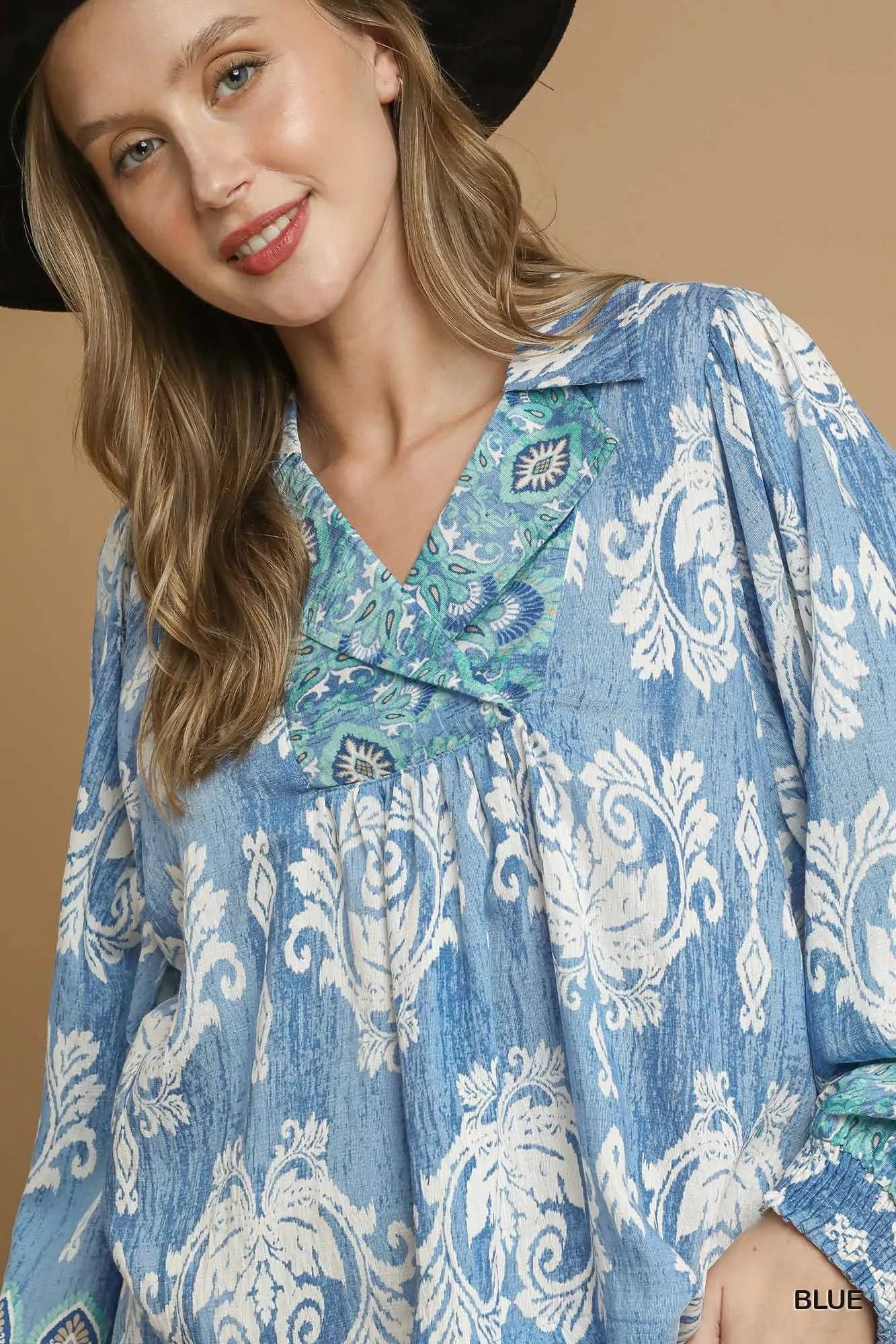 Blue Umgee printed long sleeve blouse with a relaxed fit and feminine design, perfect for casual or office wear.