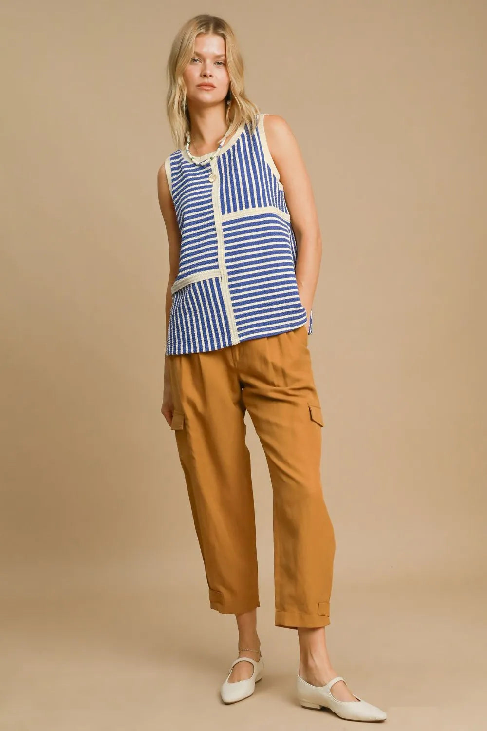 Blue Umgee round neck tank top with textured striped pattern, casual sleeveless design for a relaxed look.