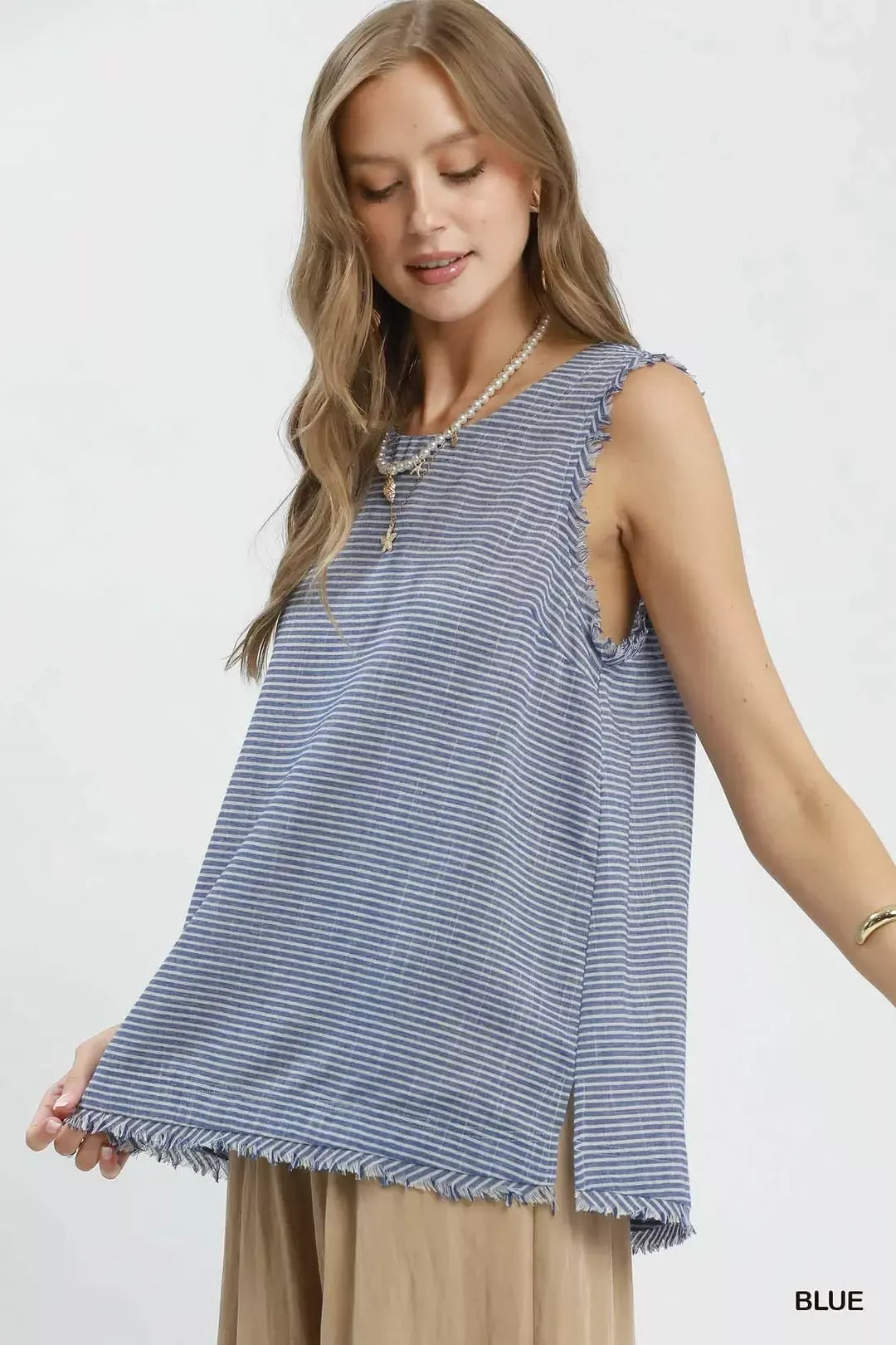 Blue Umgee sleeveless top with stripe pattern and fringe trim, featuring a stylish, casual design.