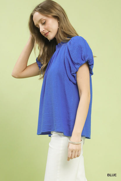 Blue Umgee textured gauze boho top with ruffle neck and relaxed fit, featuring a stylish, casual design.