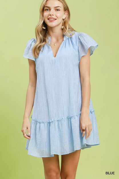 Blue Umgee textured mini dress with ruffle hem, featuring a stylish and flowy design perfect for casual or semi-formal wear.