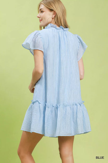 Blue Umgee textured mini dress with ruffle hem, featuring a stylish and feminine design perfect for casual or dressy occasions.