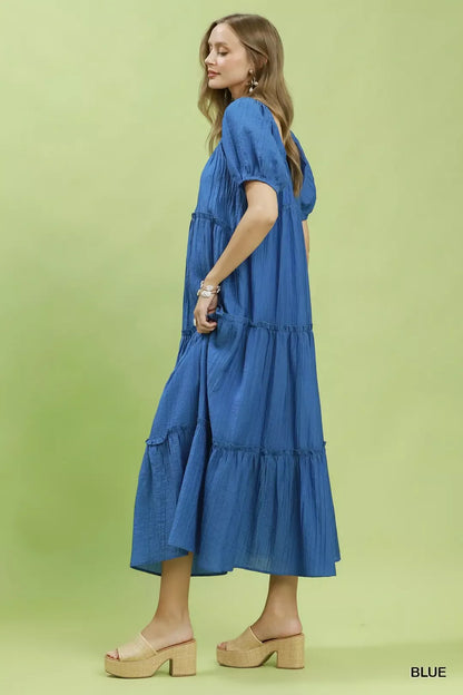 Blue Umgee textured tiered midi dress with flowing layers, featuring a relaxed fit and stylish design for casual or semi-formal wear.