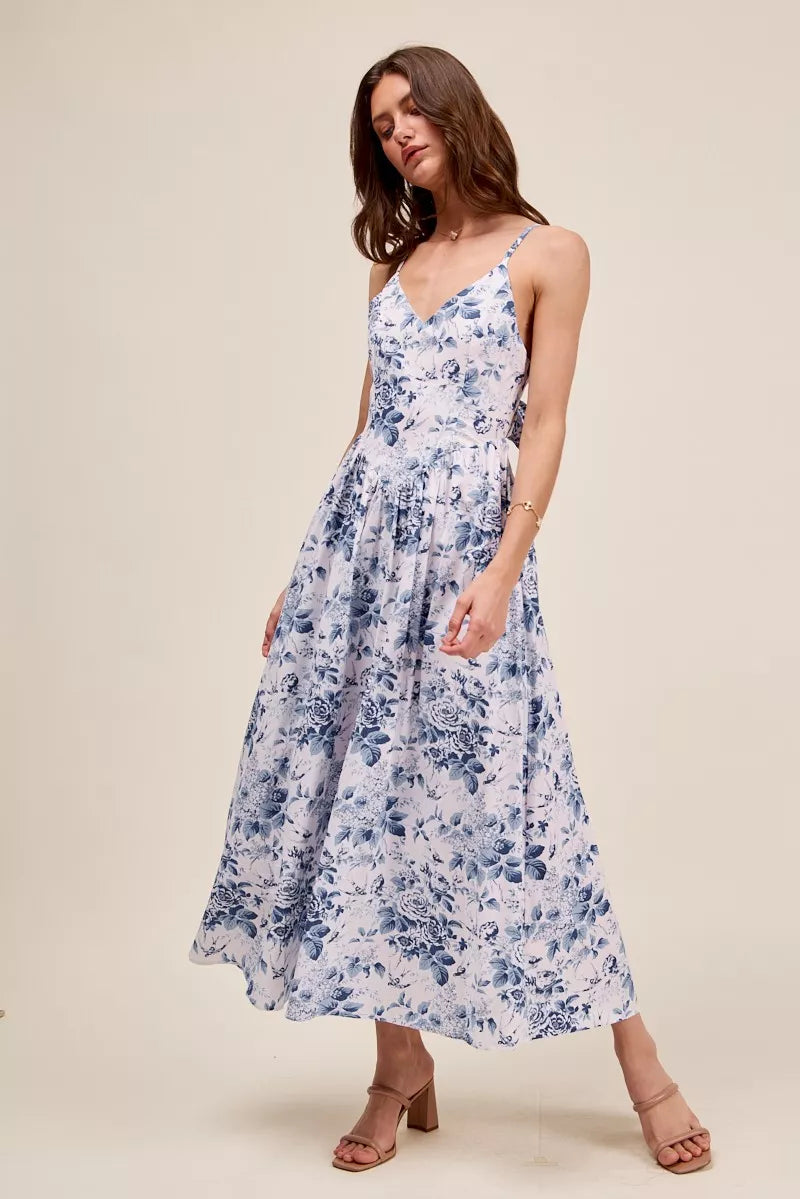 Blue floral woven V-neck dress with back ribbon tie by Trendsi, featuring a stylish and feminine design.