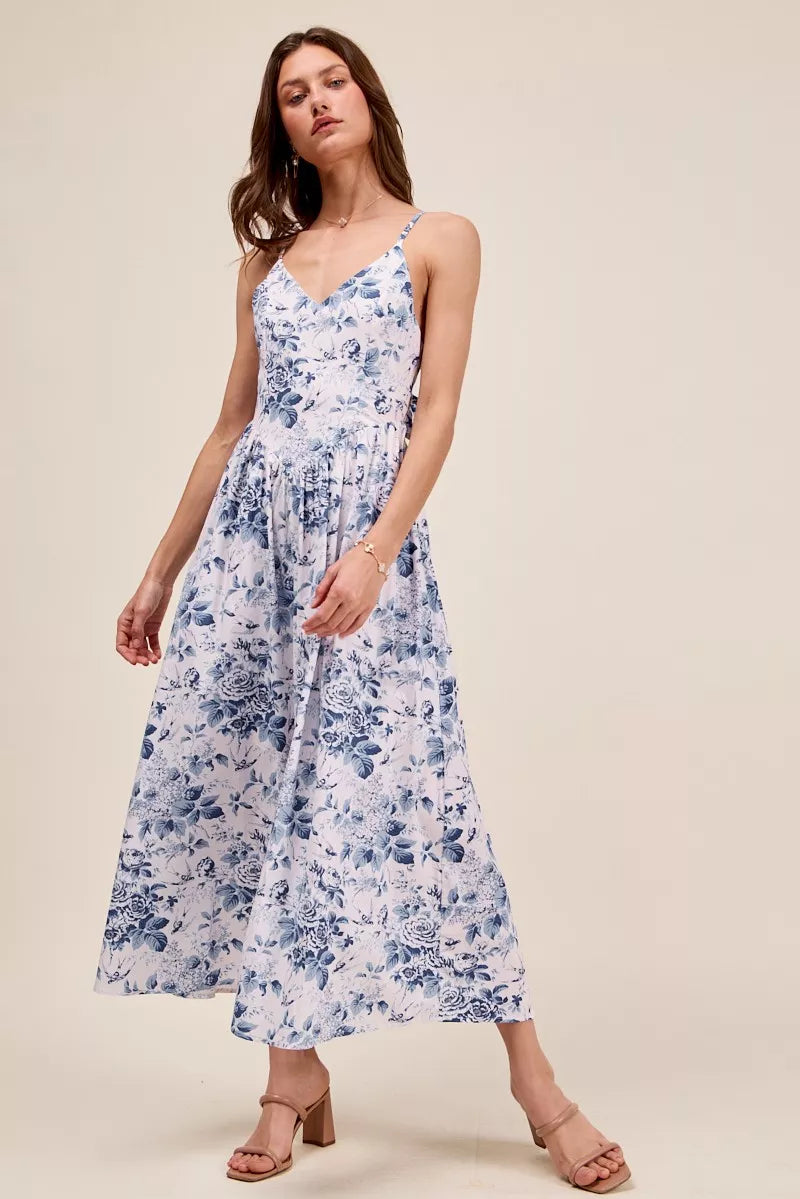 Blue floral woven V-neck dress with back ribbon tie from Trendsi, featuring a breezy, feminine design.