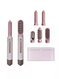 Trendsi blush pink 5-in-1 hot air styler curling iron set with European plug, various attachments for versatile hair styling.