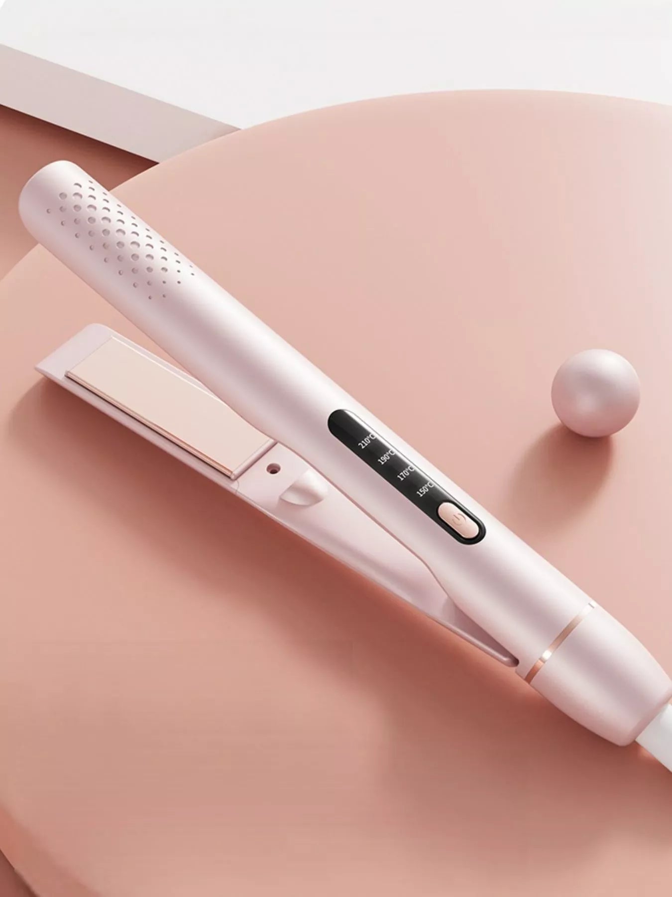 Blush pink Trendsi adjustable temperature hair straightener with European plug and ceramic plates for sleek styling.