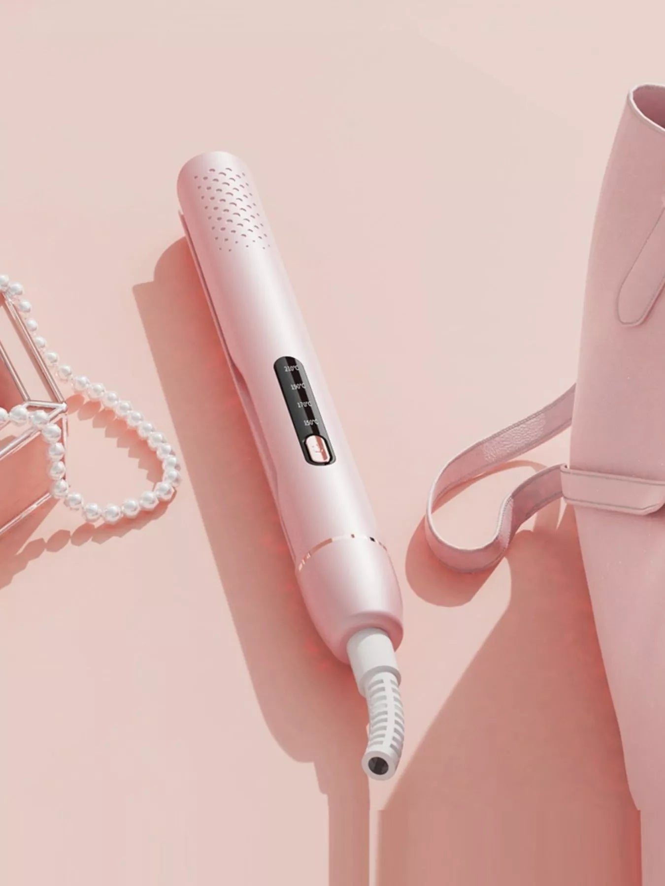 Blush pink adjustable temperature hair straightener with European plug by Trendsi, featuring sleek design and ceramic plates.