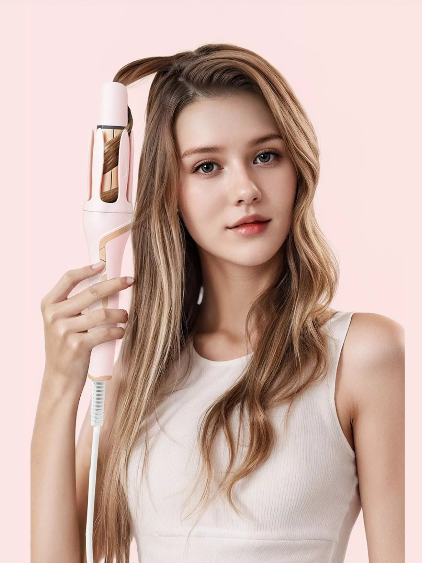 Blush pink automatic rotating ceramic curling iron with European plug by Trendsi, designed for creating smooth, curly hairstyles.