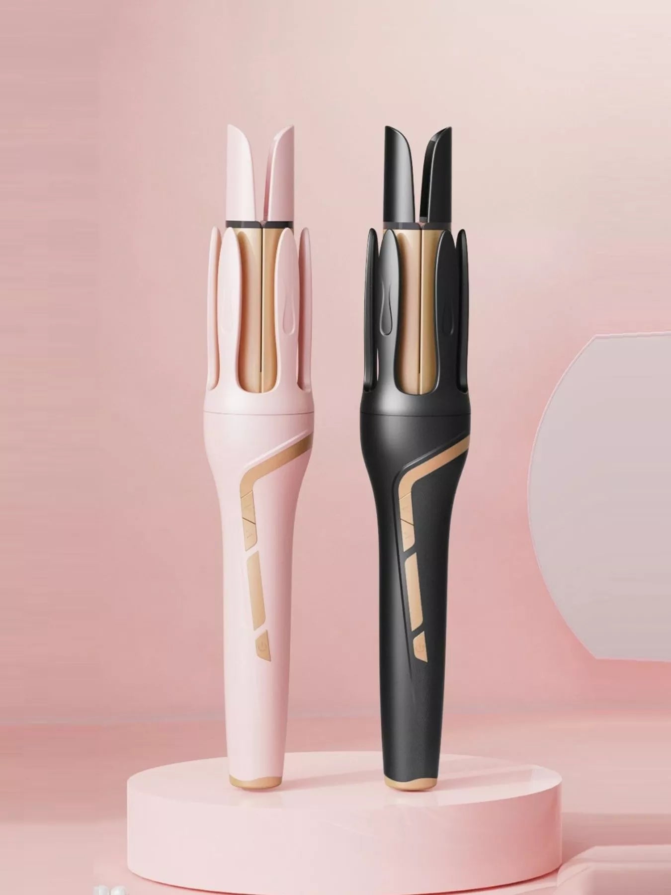 Blush pink automatic rotating ceramic curling iron with European plug for creating smooth, bouncy curls.