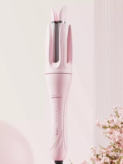 Blush pink automatic rotating ceramic curling iron by Trendsi with European plug for creating smooth, styled curls.
