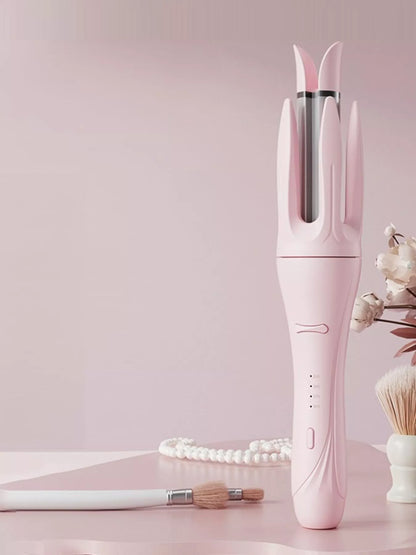 Blush pink automatic rotating ceramic curling iron by Trendsi with European plug, showcasing its sleek design and rotating barrel.