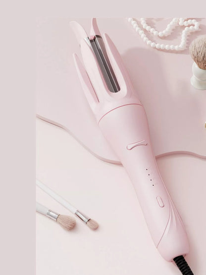 Blush pink automatic rotating ceramic curling iron by Trendsi with European plug for easy styling.