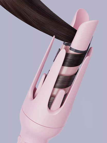 Blush pink automatic ceramic hair curling iron with European plug, featuring rotating barrel for easy styling by Trendsi.