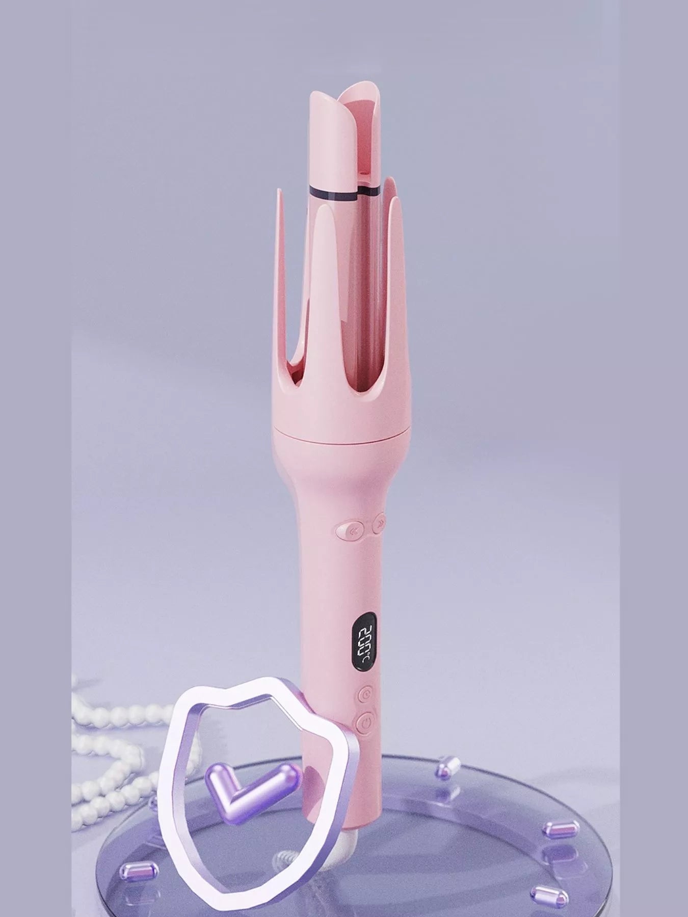 Blush pink automatic rotating ceramic hair curling iron by Trendsi with European plug, showcasing the curling barrel and control handle.