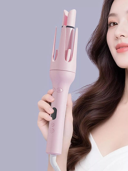 Blush pink automatic rotating ceramic hair curling iron with European plug by Trendsi, designed for creating styled curls.