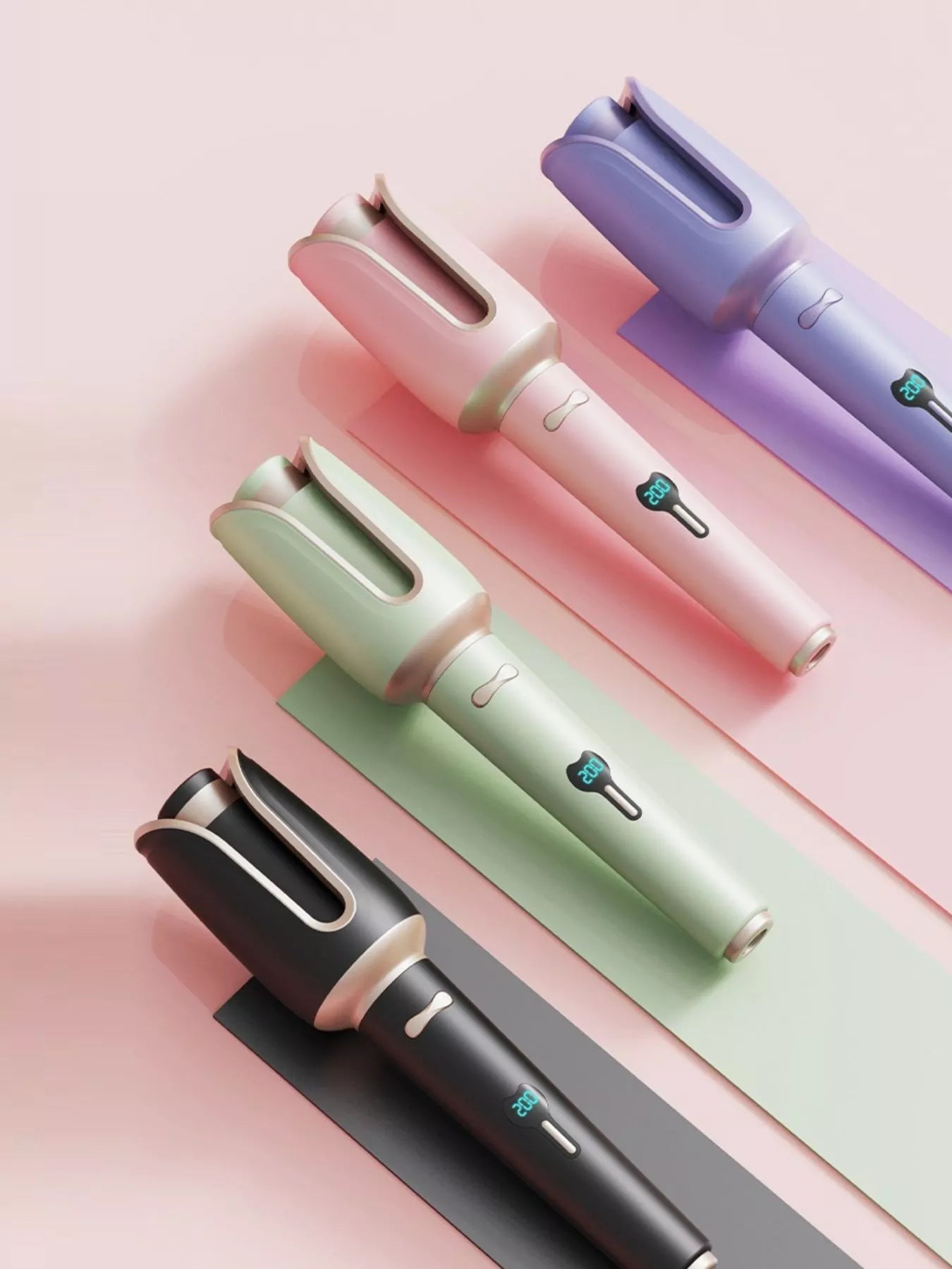 Blush pink automatic rotating ceramic hair curling iron with European plug by Trendsi, showing its sleek design and ceramic barrel.