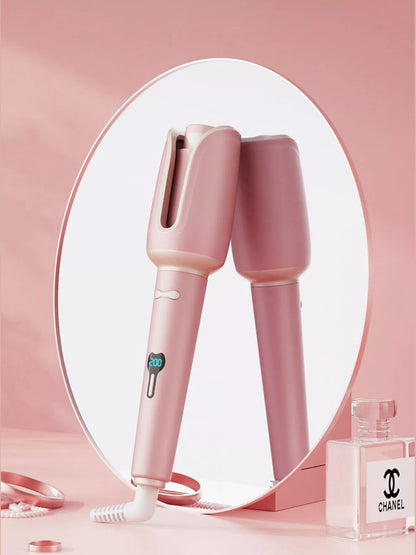 Blush pink automatic rotating ceramic hair curling iron with European plug by Trendsi, showcasing its sleek design and rotating barrel.